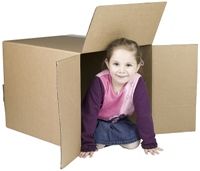 Young girl playing in a box