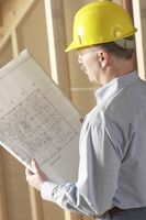 Builder looking at building plans.