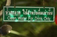 Clean water sign from Thailand in Thai and English. Purity is important physically and spiritually.