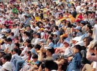 Photo of a large crowd, illustrating world population nearing 7 billion