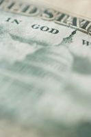 U.S. dollar bill focusing on the words 