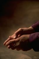 Photo of hands representing someone praying