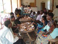 Enjoying a meal in Rwanda (photo courtesy Karen Meeker).