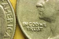 In God We Trust is embossed on a U.S. quarter, but does America trust Him?