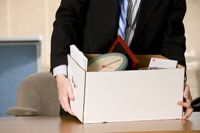 Laid off businessman packing his personal belongings