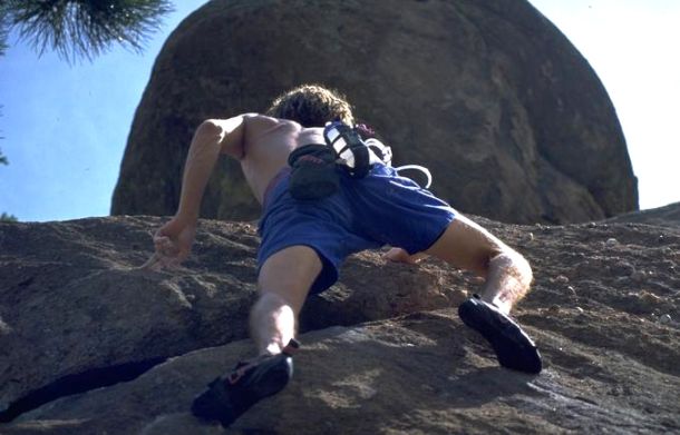 Extreme sport, man rock climbing