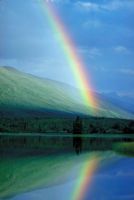 God our Father's creation, reflected in this photo of a rainbow and a lake.