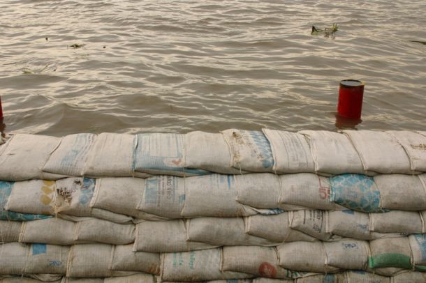 Sandbags along river to protect from a flood