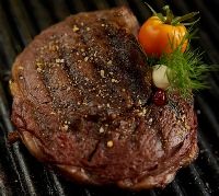 Photo of beef steak on the grill