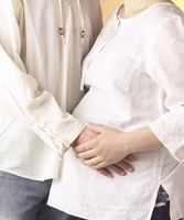 Expectant father and pregnant mother photo