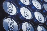 Soda cans, illustrating the profit over people motive in selling sugary sodas.