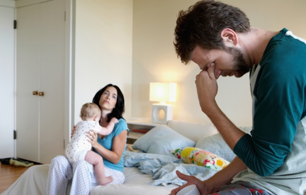 mom and dad sleeping with baby